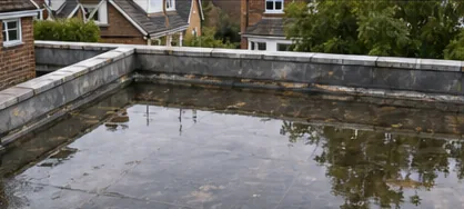 Before: Flat roof with standing water before repair