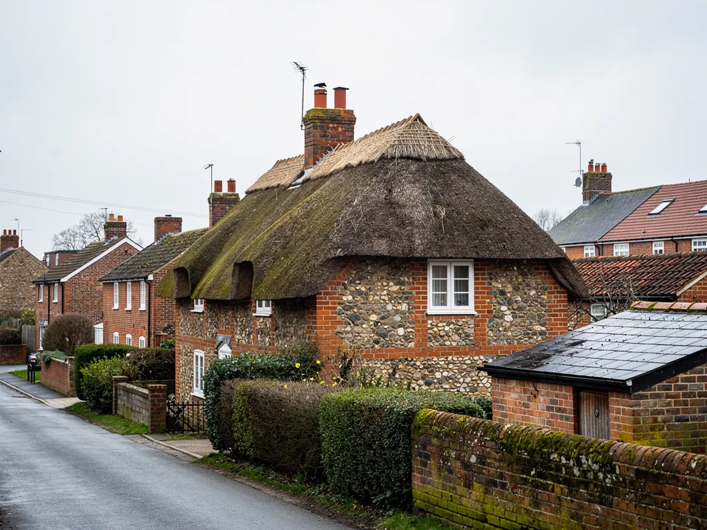 A thatched cottage in a Test Valley village with a brick chimney