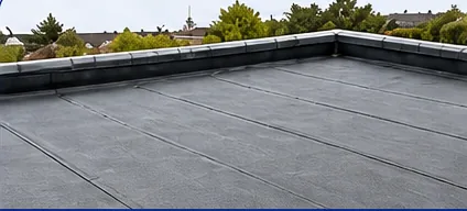 Dark grey flat roof on a house extension