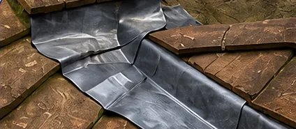 Lead flashing where a chimney meets a tiled roof